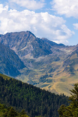 The Arbizon Massif seen from the Col d’Aspin, surrounded by verdant valleys and forested slopes of the Hautes-Pyrénées