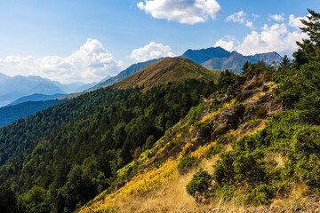The Arbizon Massif seen from the Col d’Aspin, surrounded by verdant valleys and forested slopes of the Hautes-Pyrénées