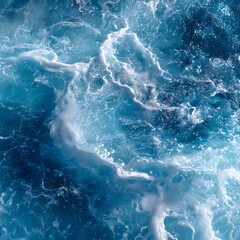 Close-up of Dynamic Blue Ocean Water Surface with White Foam and Bubbles