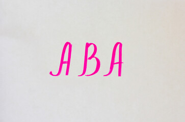 ABA pink marker handwritten text on white background