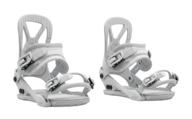 A pair of white snowboard bindings with two adjustable straps and buckles is on a clean white surface. Isolated transparent background ( cut-out PNG file ).