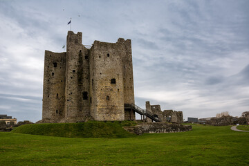 Trim Castle with clouds over green grass field
