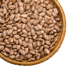 Wicker basket brimming with pinto beans on transparent background