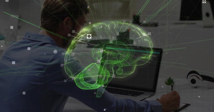 Man wearing blue shirt sketching 3D brain on tablet at office desk, with stylus, copy space