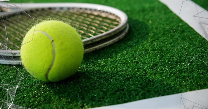 Fototapeta Resting yellow tennis ball on green turf near white boundary line, with metallic racket, copy space