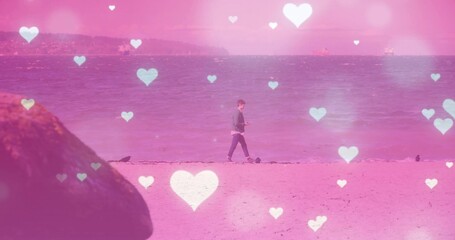 Naklejka premium Walking male holding device along shore under pink heart overlays, with seabirds and mossy rock