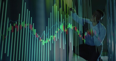 Kneeling man interacting with holographic charts in server rack corridor holding tablet, copy space