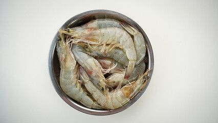 Fresh shrimps on stainless bowl, food preparation.