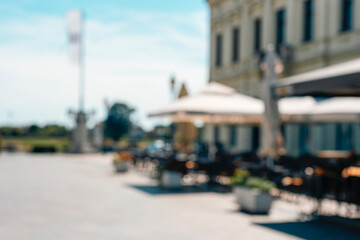 Blurred abstract background of outdoor cafe in resort town