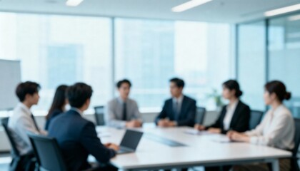Obraz premium Blurred Corporate Team Meeting in Modern Office Setting, Diverse Business Professionals Collaboration Around Conference Table