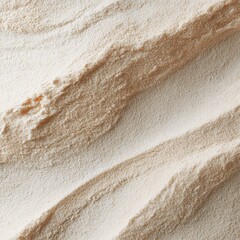 Textured beige powder surface with organic wavy lines and granular details, creating a soft abstract background