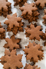 Decorating Snowflake Chocolate Ginger Sugar Cookies with Royal Icing and Sugar Crystals