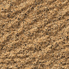 Natural golden brown sand texture with dark grains and subtle wave patterns, seamless background