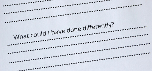 Close up of a question 'What could I have done differently?' on a sheet of paper. Self-reflection questions, therapy concept, mindfulness, psychology, thinking
