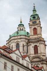 Obraz premium Church of Saint Nicholas, Baroque Roman Catholic Church in Mala Strana district in Prague, Czech Republic