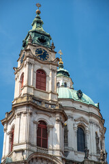 Obraz premium Church of Saint Nicholas, Baroque Roman Catholic Church in Mala Strana district in Prague, Czech Republic