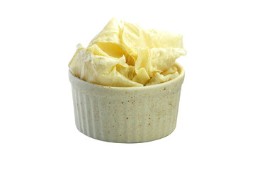 Tofu sheets in a cup placed on a white background.
