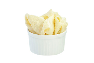 Tofu sheets in a cup placed on a white background.