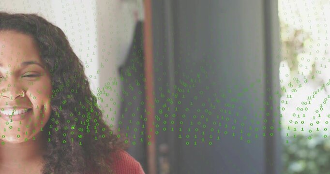 Woman standing in entryway initiating digital scan green binary code swirling around doorway fading