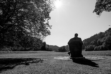 silhouette of a man sitting on a bench sculpture, Ivan Tavcar, Visoko, Slovenia