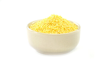 Millet in a bowl on a white background.