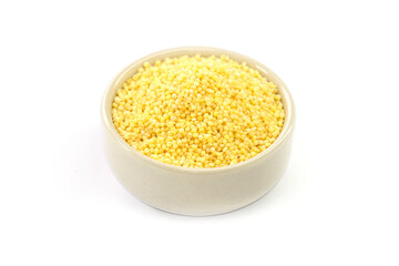 Millet in a bowl on a white background.