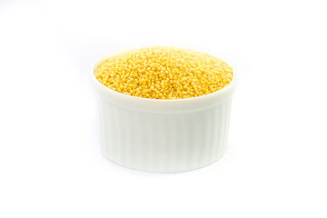 Millet in a bowl on a white background.