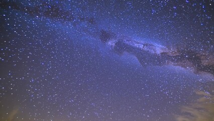 Fototapeta premium Milky is seen in night sky. A galaxy of stars and a blue sky at night. The milky way is a celestial astronomical body that is a part of the universe. The milky way is visible in the night lifestyle.