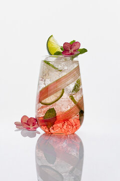 Rhubarb mojito with mint and hydrangea garnish