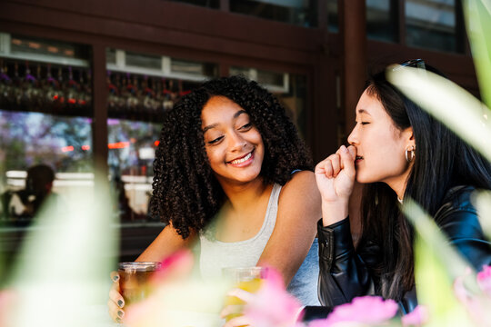 Friends enjoying drinks at an outdoor bar