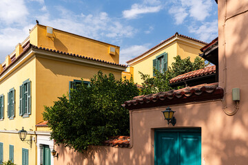 Yellow buildings and greenery in Plaka district