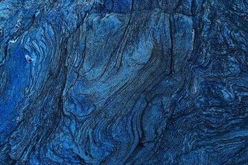 Abstract pattern of lines on the weathered surface of a rock.