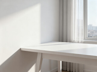 Fototapeta premium A bright white desk is positioned near a window with sheer curtains, creating a clean and minimalist interior space filled with natural light.