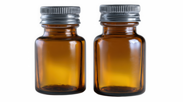 Amber glass bottles with silver caps upright on black