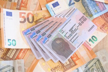 German Permanent resident card with euro money bills. Aufenthaltstitel