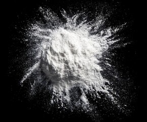 White powder explodes on black