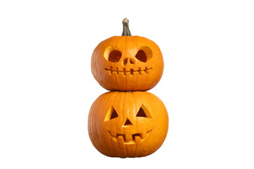 Two stacked carved Halloween pumpkins jack o’lanterns isolated on white background, spooky holiday decoration with copy space