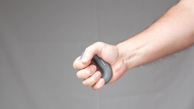 hand squeezes wrist expander