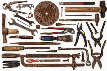 Flat lay of old hand tools on white background. Large collection of various rusty tools and bits...