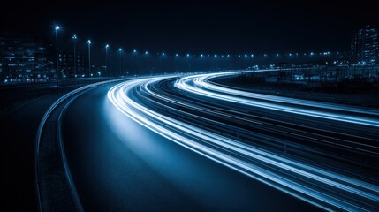 Fototapeta premium Abstract Urban Nightscape with Light Trails and Motion Blur on a Winding Highway