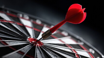 Fototapeta premium Dart hitting bullseye demonstrating success, aim, focus, goal achievement and precision in a business strategy
