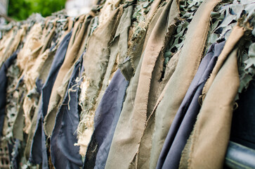 Camouflage net pattern covering military vehicle