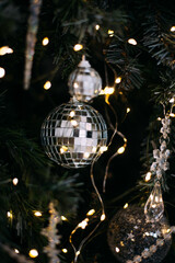 Mirrored festive bauble on christmas tree