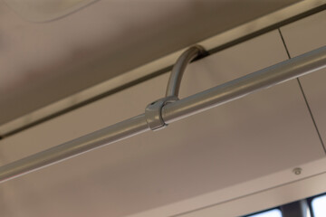 A detailed closeup image of a sturdy metal railing that is part of a trains structure, showcasing...