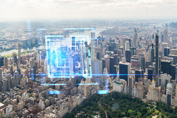 Aerial view of Manhattan overlaid with a futuristic hologram of city buildings. Double exposure