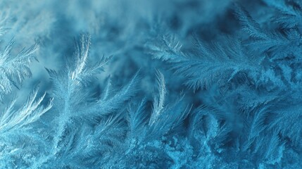 an image featuring a close up of ice crystals in deep blue, resembling a snowflake pattern with a contrasting lighter area, suggesting a frosty surface in the background