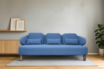 Modern minimalist living room with stylish gray, blue fabric sofa, couch decorative cushions,  wall art, wooden furniture, indoor plant and cozy rug, contemporary home interior design inspiration.