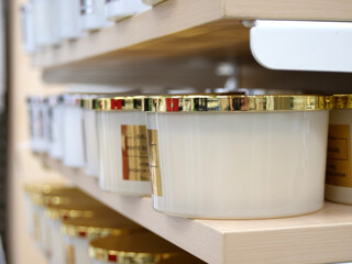 White and gold storage canisters - A Shelf with Modern White and Gold Ceramic Storage Canisters