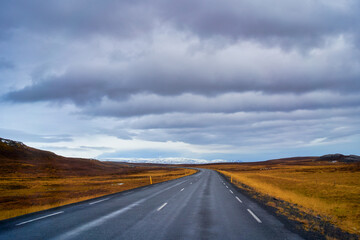 Road trip view with long road by the ring road plan for travel by car in Iceland , Amazing view with high layer cloud.