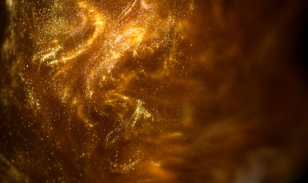 Gold particles floating abstract background, Liquid gold, golden art, abstract backdrop. Beautiful metallic dust yellow texture, Metallic paint close-up. Art Wallpaper waves surface - Powered by Adobe